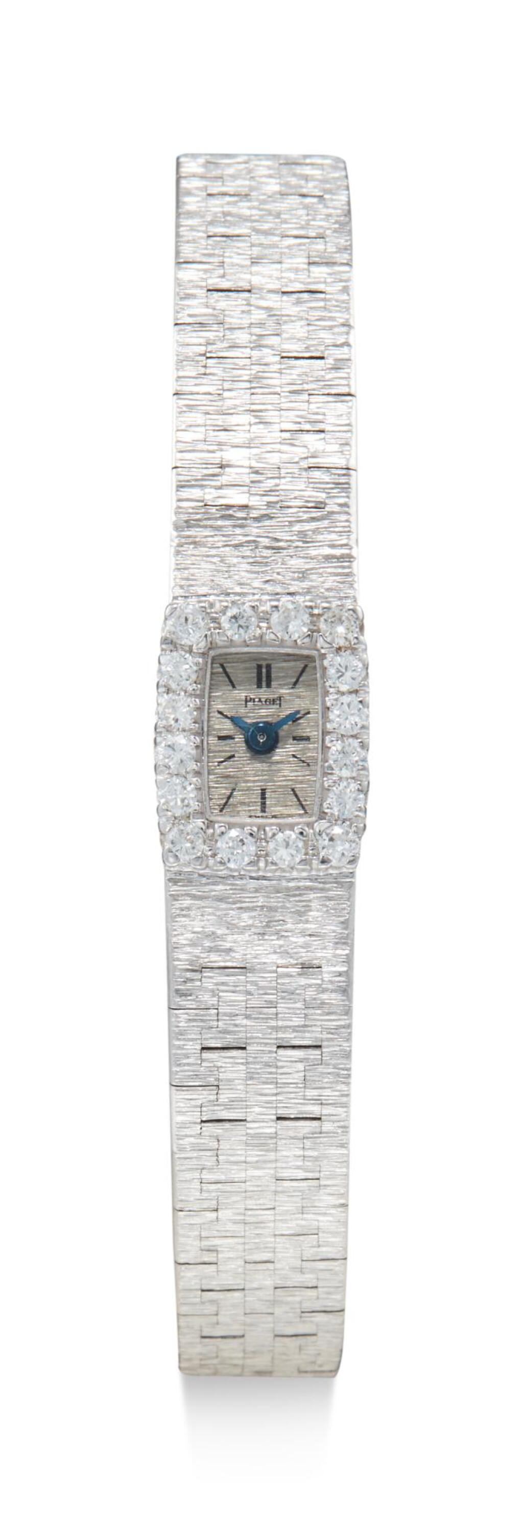 View full screen - View 1 of Lot 8091. PIAGET | REFERENCE 1308 A 6, A WHITE GOLD AND DIAMOND-SET BRACELET WATCH, CIRCA 1960.