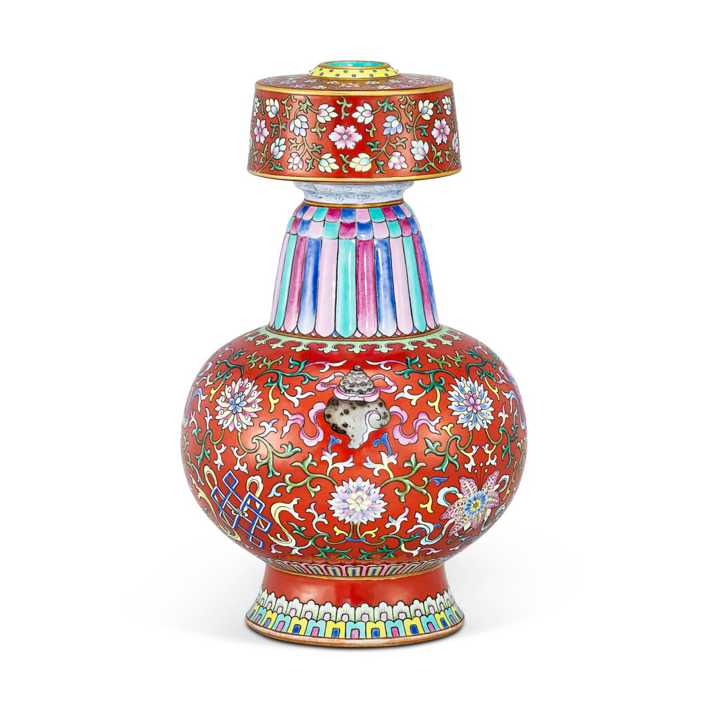 View full screen - View 1 of Lot 459. A FINE AND EXTREMELY RARE CORAL-RED GROUND FAMILLE-ROSE ALTAR VASE SEAL MARK AND PERIOD OF QIANLONG | 清乾隆 粉彩珊瑚紅地番蓮八吉祥紋賁巴壺 《大清乾隆年製》款 .