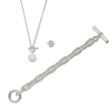 View full screen - View 1 of Lot 5704. Set of 3 Sterling Silver Echappee Hermes Ring, Chaine d'ancre Bracelet and Amulettes H Ex-Libris Pendant.