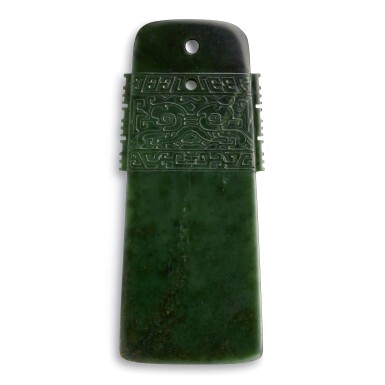 View full screen - View 1 of Lot 15. A FINELY CARVED IMPERIAL SPINACH-GREEN JADE AXE FANGGU MARK AND PERIOD OF QIANLONG | 清乾隆 御製碧玉仿古獸面紋斧 《大清乾隆仿古》、《月字第十六號》款.