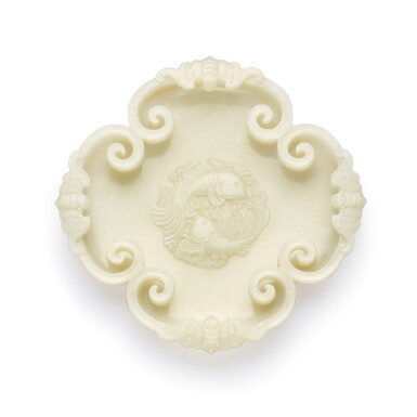 View full screen - View 1 of Lot 3651. A white jade lobed 'twin fish' ink palette Qing dynasty, Qianlong period | 清乾隆 白玉年年有餘如意有福筆掭.