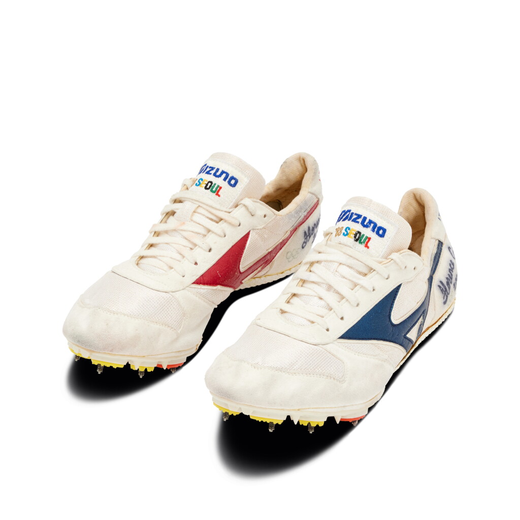 View full screen - View 1 of Lot 11. Florence Griffith Joyner 'World Record Setting and Gold Medal Winning' 200m Signed and Inscribed Spikes | 1988 Olympic Games | 21.34 Seconds.
