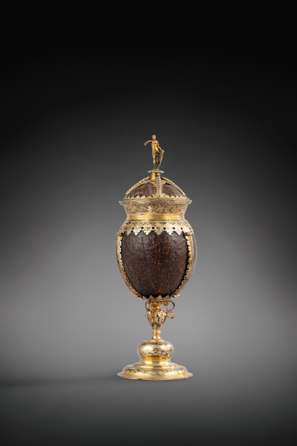 View full screen - View 1 of Lot 131. A German covered silver-gilt mount coconut cup, apparently unmarked, dated 1644 | Coupe couverte en noix de coco montée en vermeil, apparemment non poinçonnée, probablement Allemagne, datée 1644.
