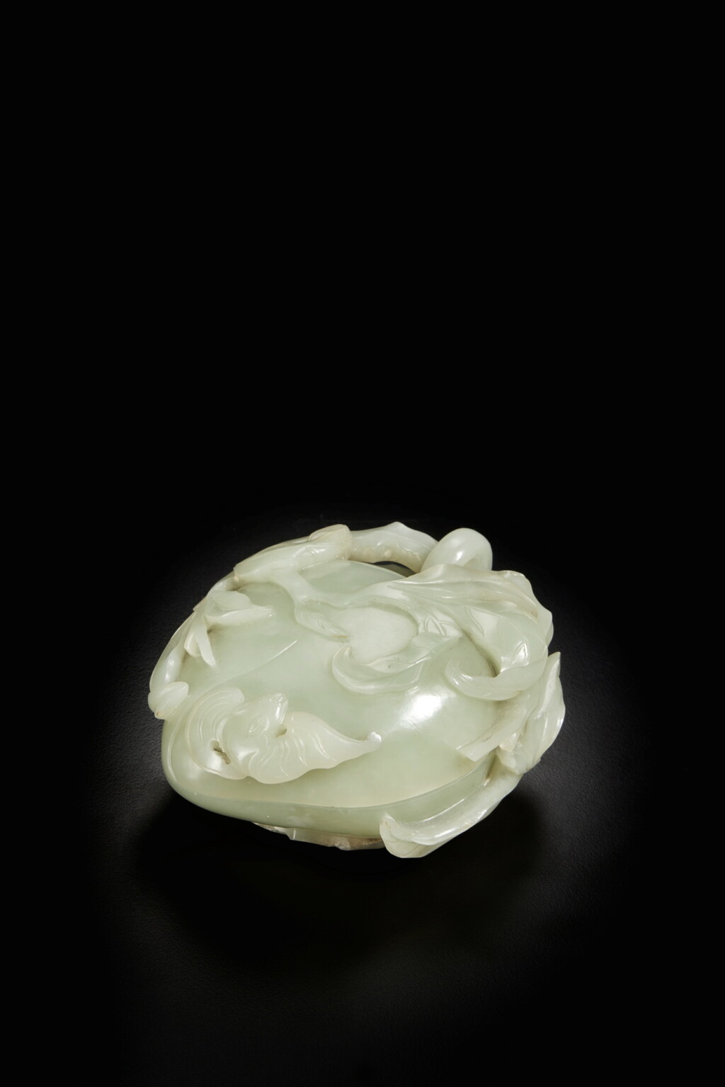 View full screen - View 1 of Lot 178. A pale celadon jade 'peach' box and cover, Qing dynasty, Qianlong period.