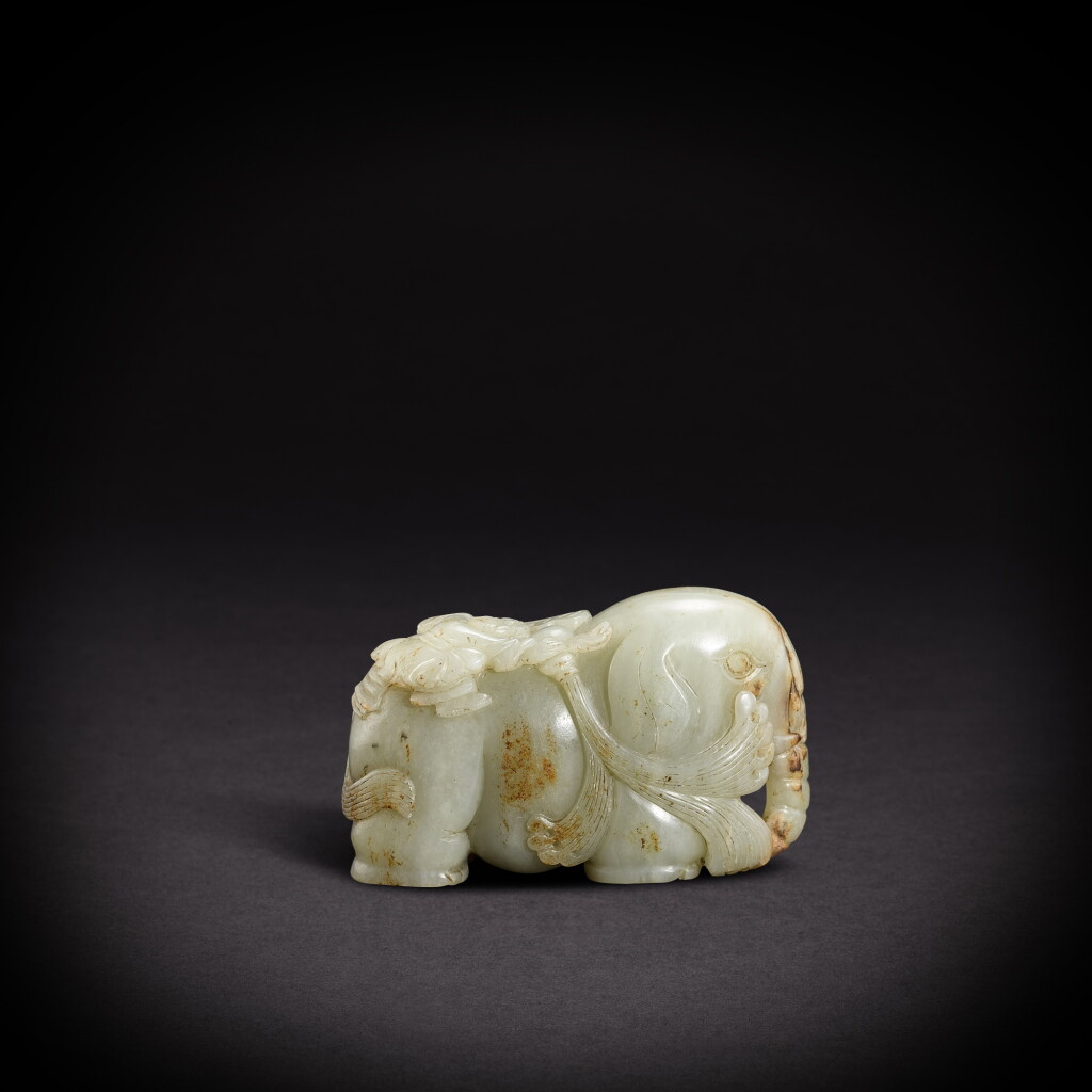 View full screen - View 1 of Lot 5823. A pale celadon jade 'elephant and boy' group, Ming dynasty | 明 青白玉童子洗象.