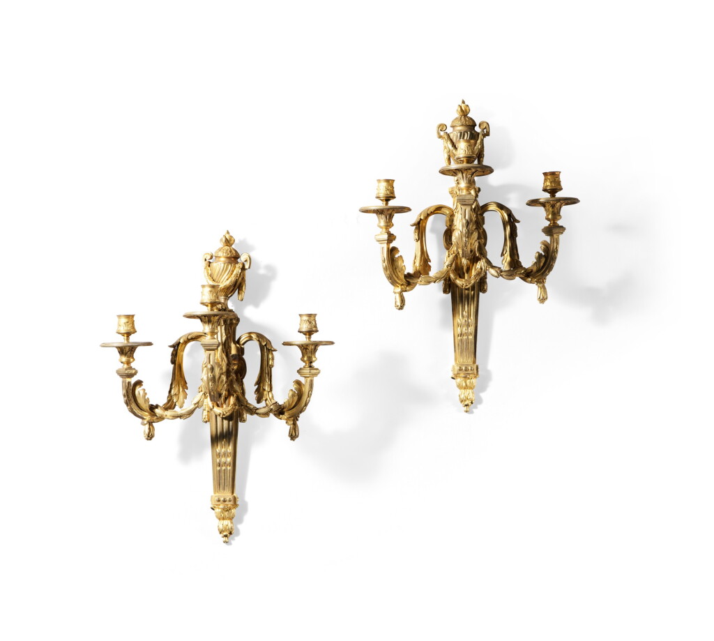 View full screen - View 1 of Lot 115. A pair of gilt-bronze wall-lights, in Louis XVI style, second half 19th century | Paire de grandes appliques au vase en bronze doré de style Louis XVI, seconde moitié du XIXe siècle.