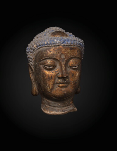 View full screen - View 1 of Lot 213. A large gilt stucco head of a Buddha Ming dynasty, probably 16th century | 明 或為十六世紀 彩繪泥塑佛首.