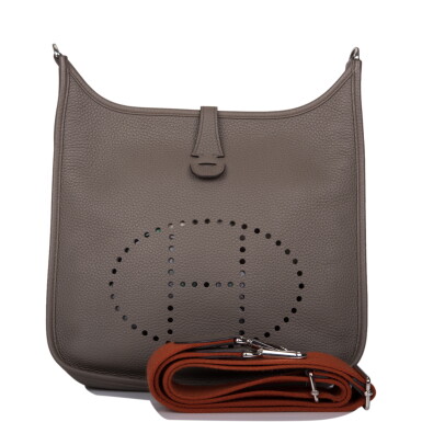 View full screen - View 1 of Lot 30. HERMÈS | GRIS ETAIN EVELYNE III PM IN TAURILLON CLEMENCE LEATHER WITH PALLADIUM HARDWARE.