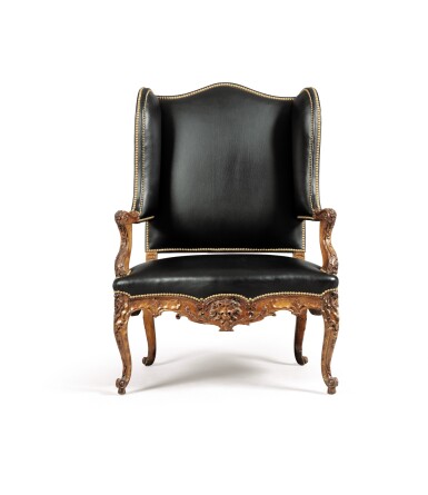 View full screen - View 1 of Lot 109. A RÉGENCE CARVED WALNUT BERGÈRE À OREILLES | BERGÈRE À OREILLES EN NOYER SCULPTÉ D'ÉPOQUE RÉGENCE.