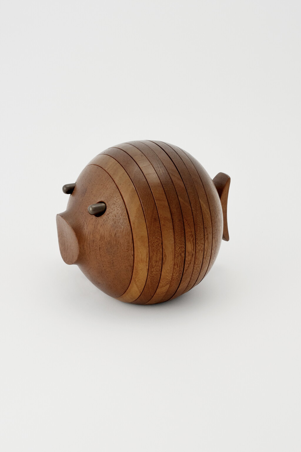 View full screen - View 1 of Lot 22. A DANISH TEAK "FISH" COASTER SET.