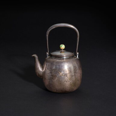 View full screen - View 1 of Lot 659. A parcel-gilt silver 'prunus and bamboo' kettle, Japan, Meiji period 明治時期 「王章畫 一也刻」銘梅竹刻银壺 《純銀》《生秀館》款.