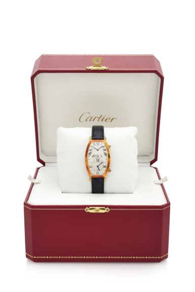 View full screen - View 1 of Lot 14. TONNEAU DUAL TIME ZONE, REFERENCE 116-88 YELLOW GOLD TONNEAU-SHAPED DUAL TIME ZONE WRISTWATCH (OROLOGIO DA POLSO IN ORO GIALLO MODELLO ‘TONNEAU’ CON DOPPIO FUSO ORARIO) CIRCA 1990 | CARTIER, PARIS.