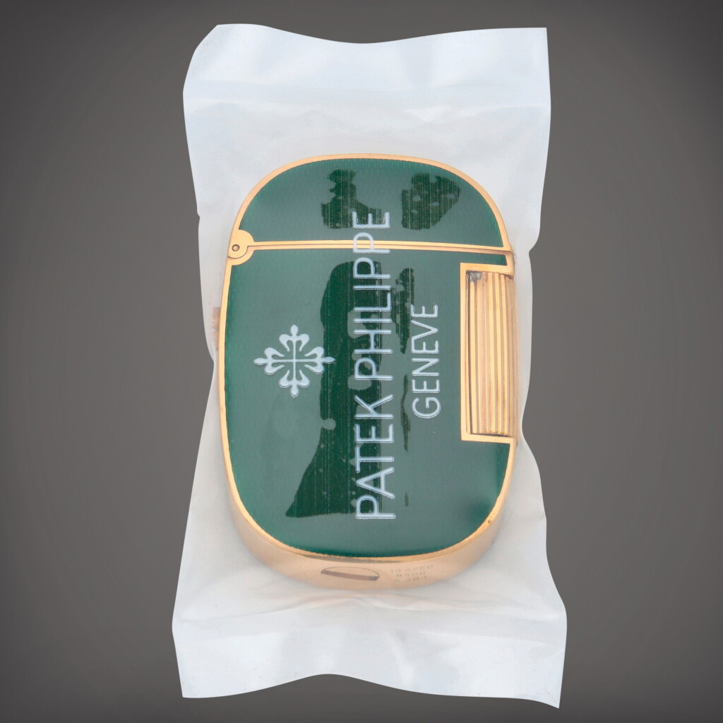 View full screen - View 1 of Lot 250. Golden Ellipse, Reference 9508 | A yellow gold and green enamel lighter | Circa 1980.