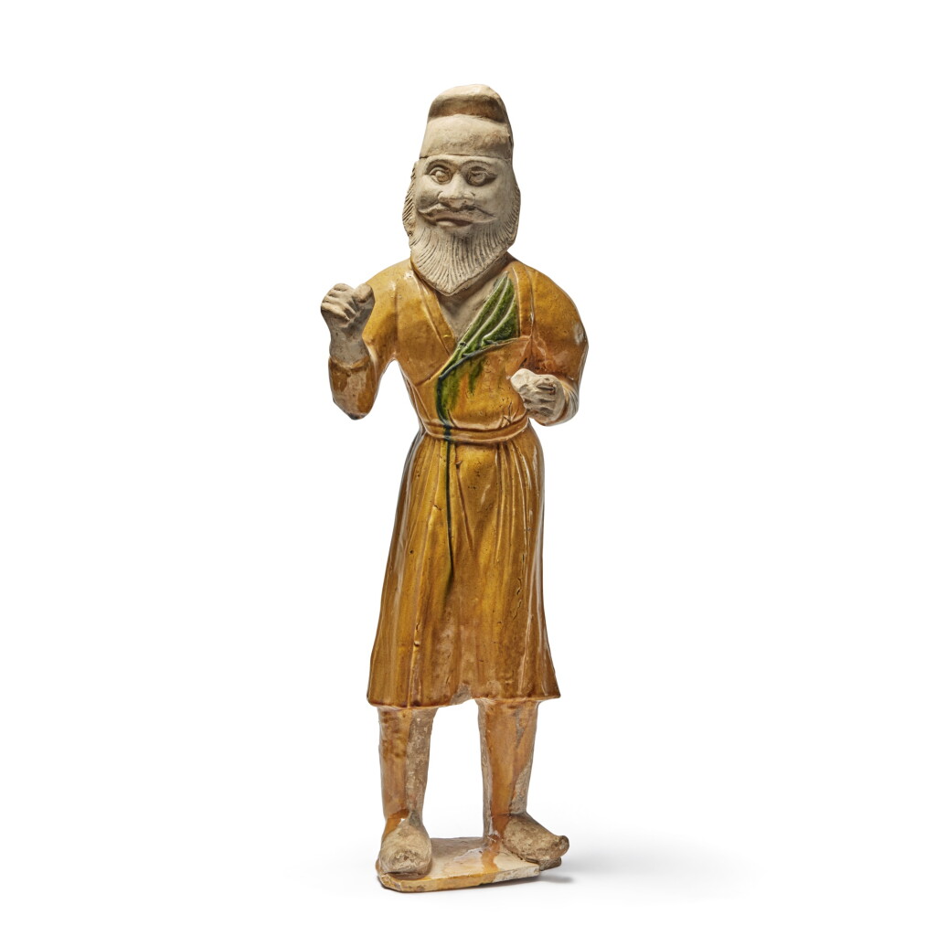 View full screen - View 1 of Lot 247. A large sancai-glazed pottery figure of a foreign groom, Tang dynasty.
