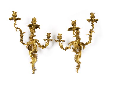 View full screen - View 1 of Lot 24. A Near Pair of Louis XV Gilt-Bronze Three-Branch Wall Lights, Mid-18th Century.