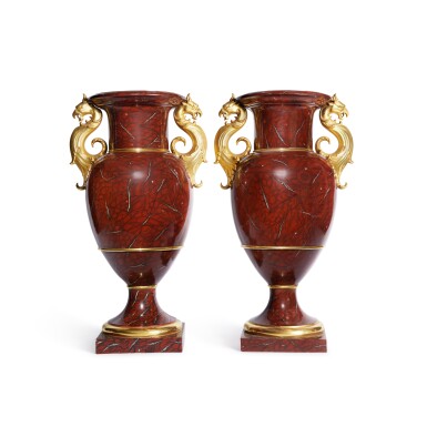 View full screen - View 1 of Lot 113. A Pair of Monumental Berlin (K.P.M.) 'Rosso Antico' Faux-Marble Vases, 'Französische form mit Greifenkopfhenkeln', Circa 1849-70.