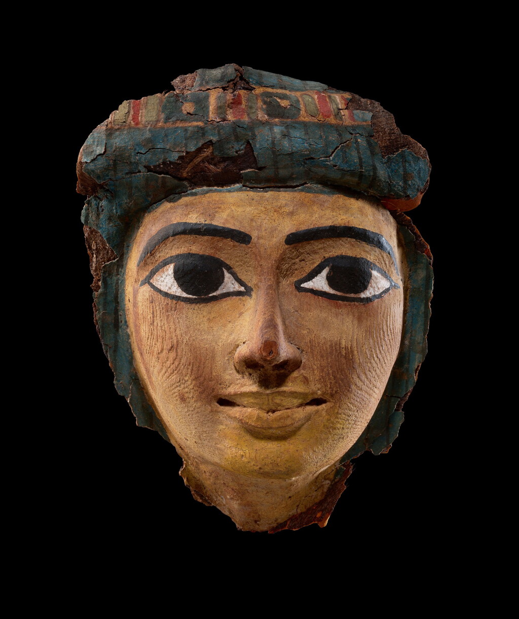 View full screen - View 1 of Lot 59. An Egyptian Polychrome Wood Mummy Mask, 21st/22nd Dynasty, 1075-716 B.C..