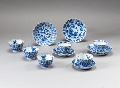View full screen - View 1 of Lot 104. A group of six blue and white 'floral' cups and five saucers, Qing dynasty, Kangxi period | 清康熙 青花花卉紋花口盃及小盤 一組十一件.