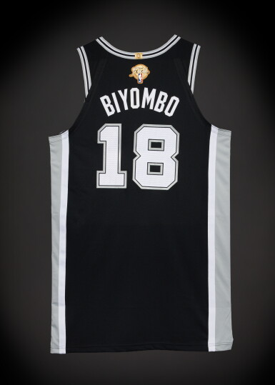 View full screen - View 1 of Lot 32. Bismack Biyombo San Antonio Spurs 2026 NBA Finals Game Issued Icon Edition Jersey | Game 1 | Matched to Game 1 Locker Room Image.
