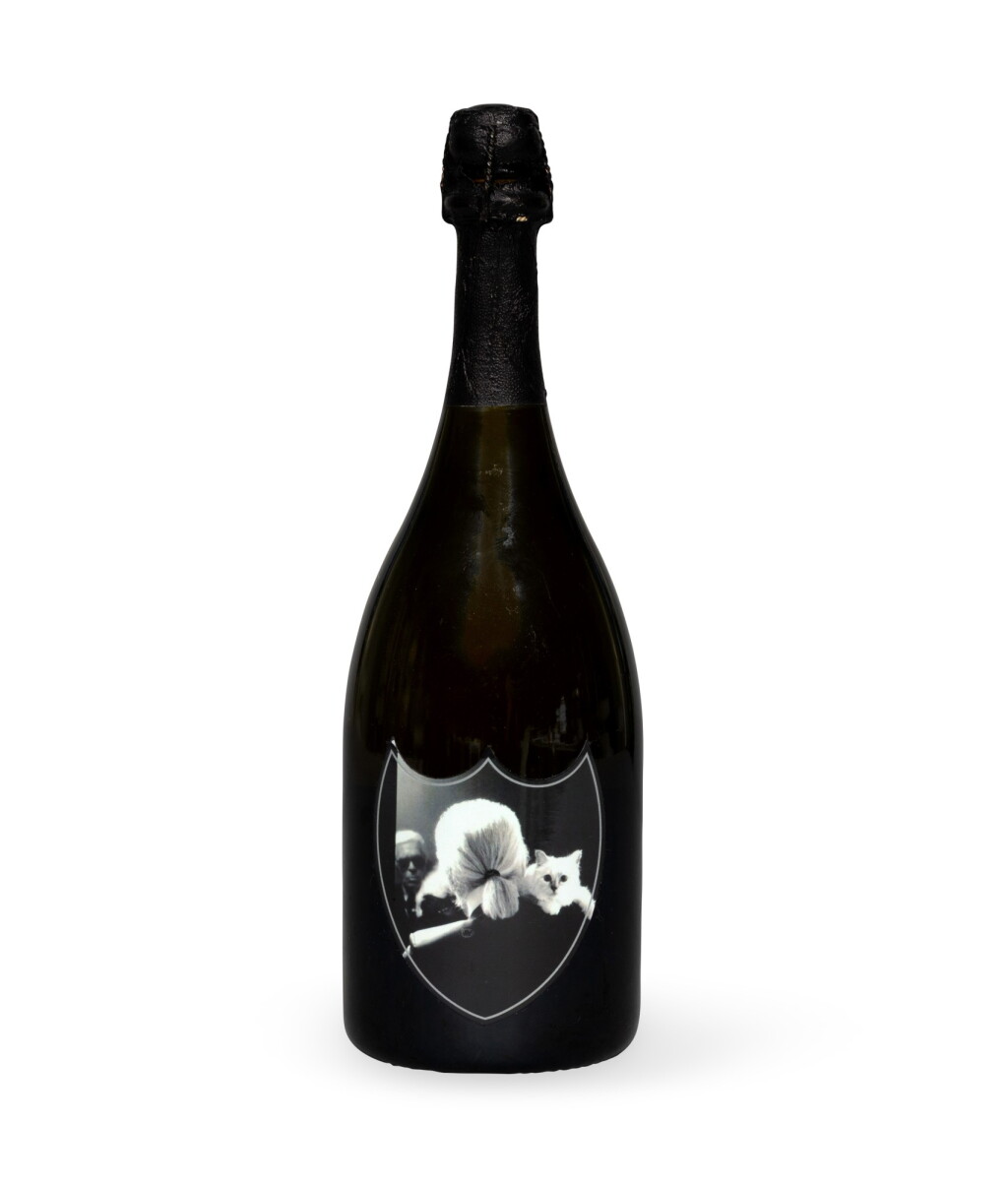 View full screen - View 1 of Lot 2182. Dom Pérignon, Vintage 2003, the label with a reproduction of an autoportrait of Karl Lagerfeld and choupette | Dom Pérignon, Millésime 2003, l'étiquette reproduisant un autoportrait de Karl Lagerfeld et choupette.