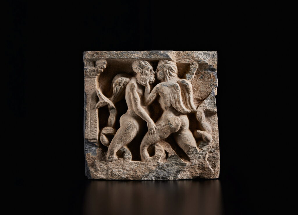 View full screen - View 1 of Lot 351. A gray schist 'winged triton' erotic panel, Ancient Region of Gandhara, circa 2nd / 3rd century.