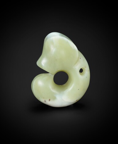 View full screen - View 1 of Lot 79. A rare and subtly carved celadon jade 'pig-dragon', zhulong Neolithic period, Hongshan culture | 新石器時代 紅山文化青白玉豬龍.
