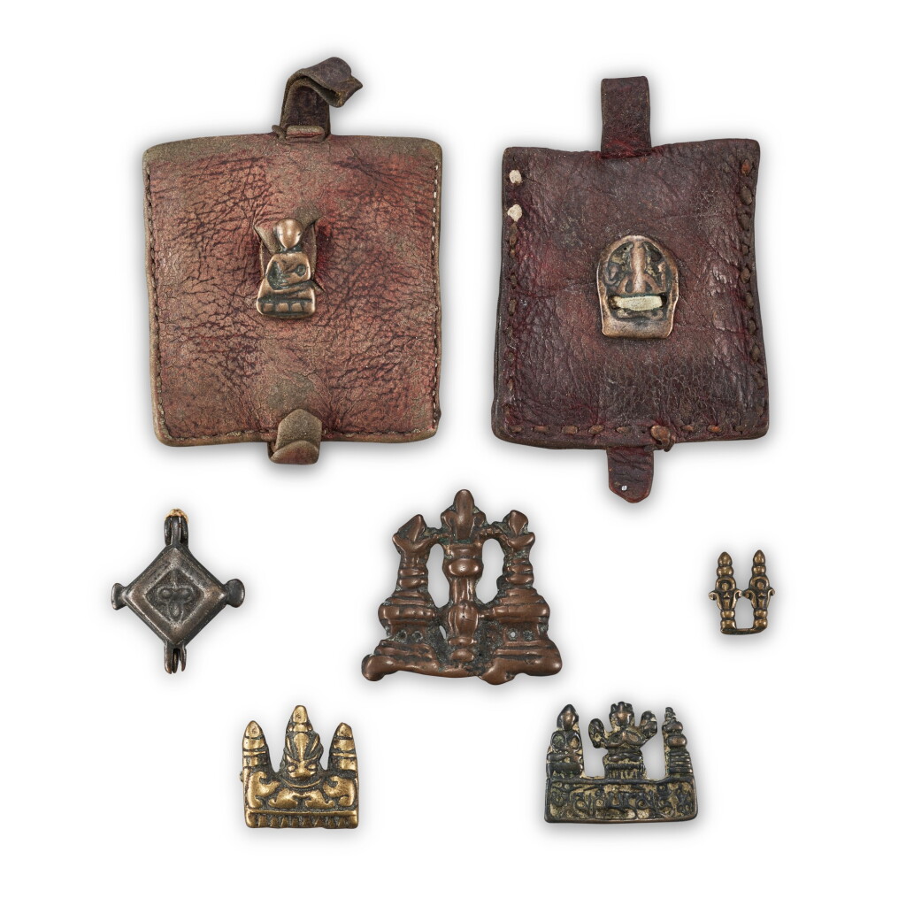 View full screen - View 1 of Lot 3028. A group of copper-alloy 'stupa' thogchags, Gau box and leather pouches, Tibet, 12th - 15th century 十二至十五世紀 西藏 各式舍利塔天鐵、嘎鳥及皮包一組七件.
