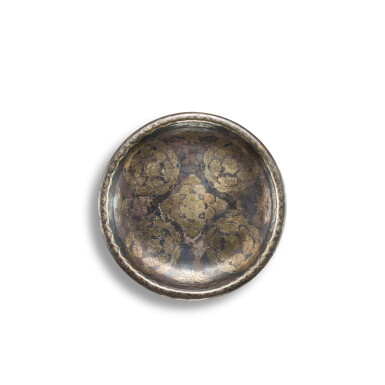 View full screen - View 1 of Lot 3609. A parcel-gilt silver 'floral' dish, Tang dynasty | 唐 銀局部鎏金團花紋盤.