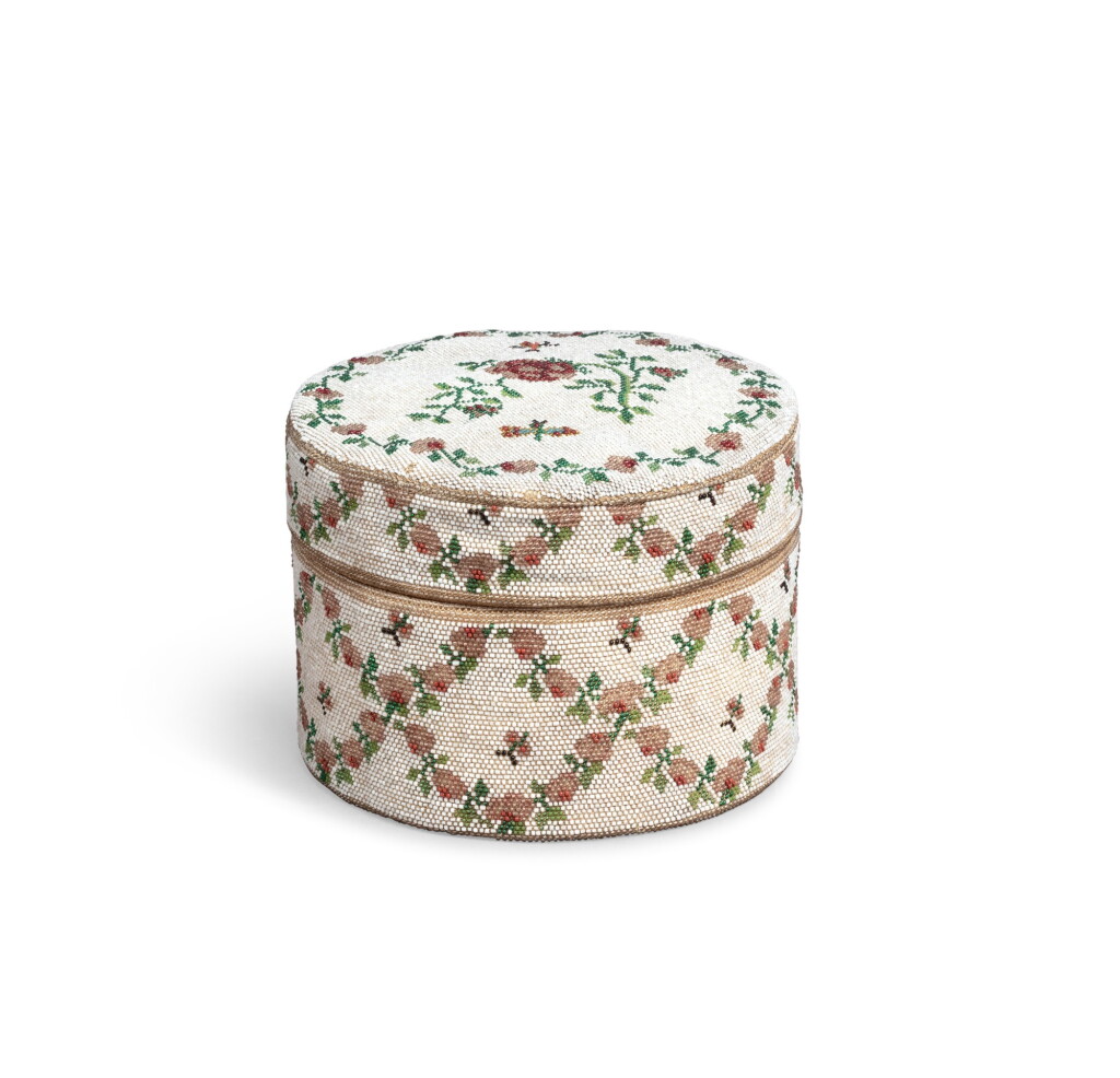 View full screen - View 1 of Lot 83. A coloured glass bead embroidered cylindrical box, probably French or German, 18th century | Petite boîte en perlé, probablement allemand ou français, XVIIIe siècle.