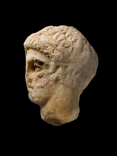 View full screen - View 1 of Lot 237. An Attic Marble Relief Head of a Youth, 4th Century B.C..