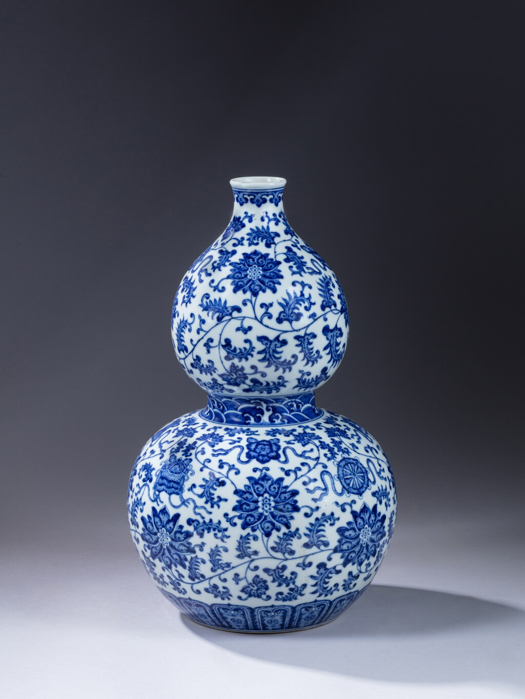 View full screen - View 1 of Lot 393. A blue and white 'Eight Buddhist Emblems' double-gourd vase, 20th century.
