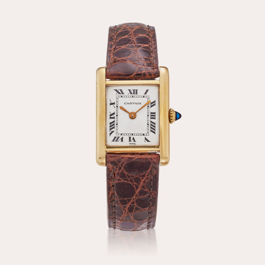 View full screen - View 1 of Lot 70. Reference 78087 Tank Louis | A yellow gold rectangular wristwatch with Paris dial, Circa 1974 and Owned by Buffy Birrittella.