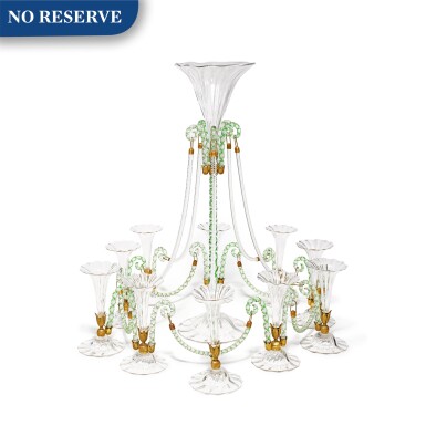View full screen - View 1 of Lot 381. A Blown and Cut Clear and Green Glass and Gilt.mes
tal Eleven-Vase Epergne, Late 19th/20th Century.