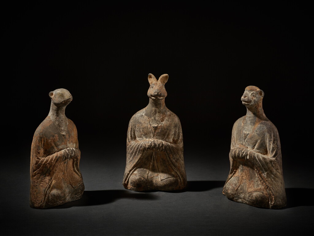 View full screen - View 1 of Lot 220. Three gray pottery seated zodiac figures, Northern Wei dynasty | 北魏 灰陶生肖坐俑三件.