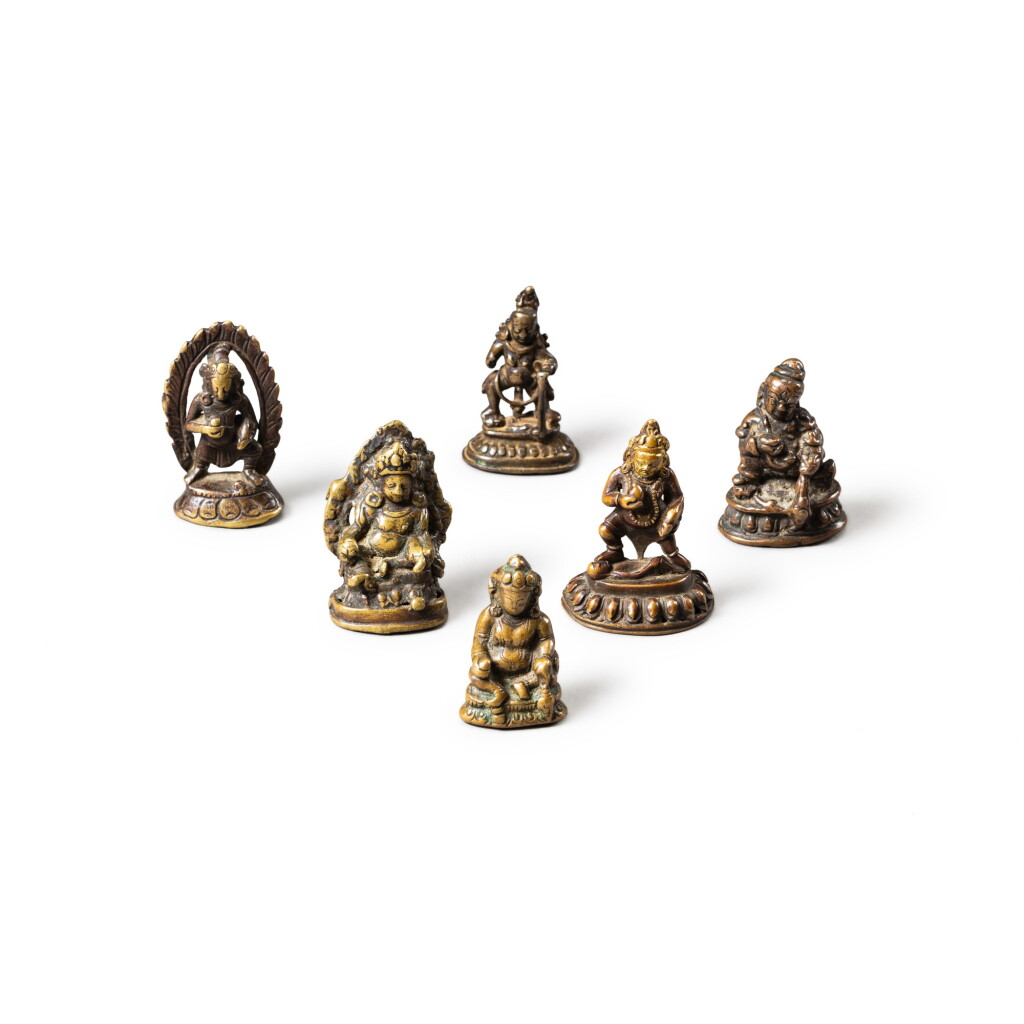 View full screen - View 1 of Lot 94. A group of six small copper-alloy figures of 'wealth' deities Tibet, 14th-16th century | 西藏 十四至十六世紀 合金銅佛像一組六尊.