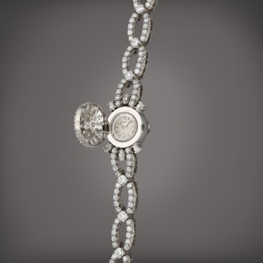 View full screen - View 1 of Lot 114. A platinum and diamond-set bracelet watch, Circa 1940.