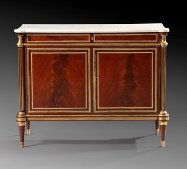 View full screen - View 1 of Lot 47. A giltbronze mounted flammed mahogany commode à portes, Louis XVI, circa 1785, attributed to Adam Weisweiler | Commode à portes en placage d'acajou flammé d'époque Louis XVI vers 1785, attribuée à Adam Weisweiler.