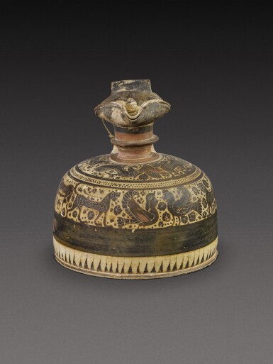 View full screen - View 1 of Lot 172. A Corinthian Black-figured Oinochoe, attributed to the Candida Painter, circa 570-565 B.C.