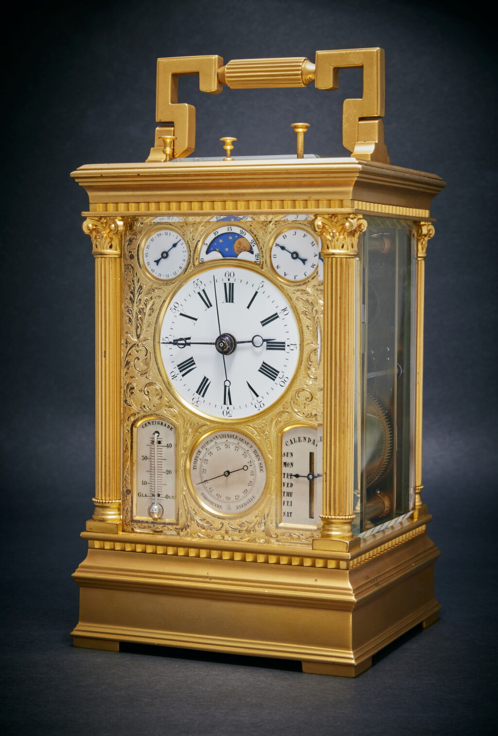 View full screen - View 1 of Lot 31. A rare French gilt-brass grande sonnerie, minute repeating center-seconds carriage clock with fly-back calendar, thermometer, barometer and moon phases, Circa 1880.