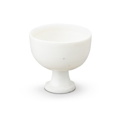 View full screen - View 1 of Lot 17. A rare small white-glazed stemcup Ming dynasty, Wanli period | 明萬曆 白釉高足盃.