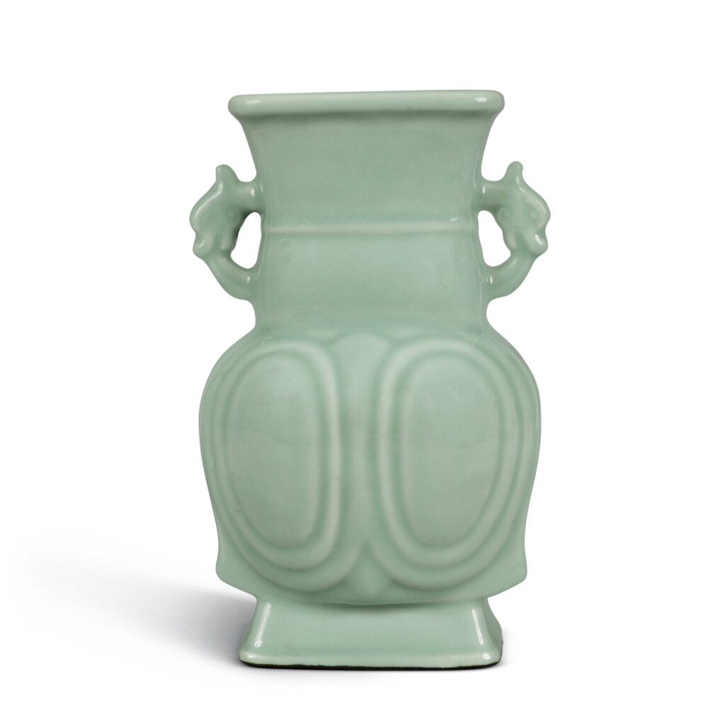 View full screen - View 1 of Lot 185. A molded archaistic celdon-glazed handled vase, Qing dynasty, 18th century.