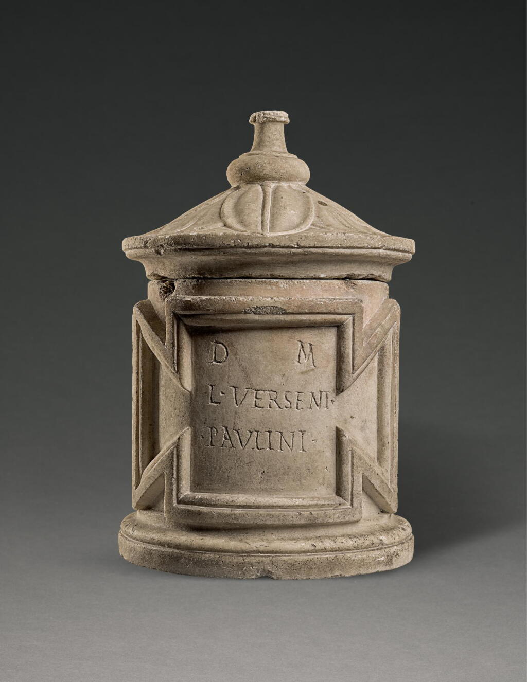 View full screen - View 1 of Lot 255. A MARBLE CINERARY URN INSCRIBED FOR LUCIUS VERSENUS PAULINUS, 1ST/2ND CENTURY A.D..