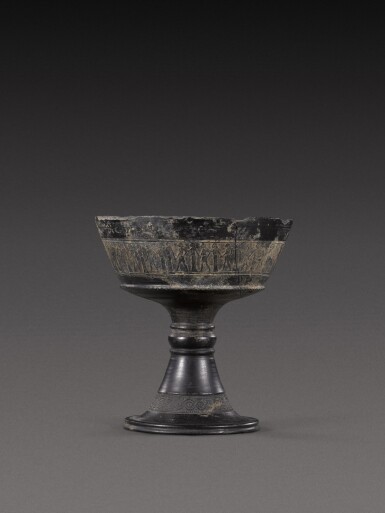 View full screen - View 1 of Lot 104. An Etruscan Bucchero Chalice, circa mid-6th Century B.C..
