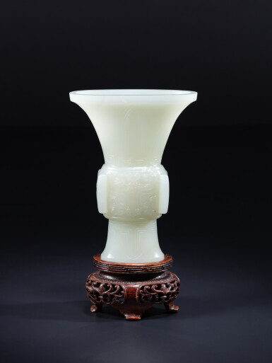 View full screen - View 1 of Lot 123. A white jade 'taotie' gu-form vase, Qing dynasty, Qianlong period.