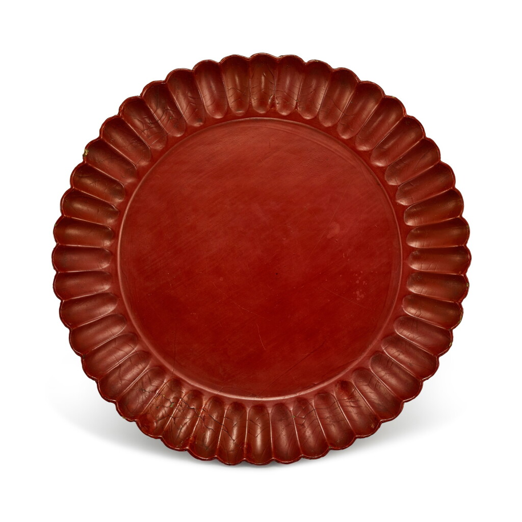 View full screen - View 1 of Lot 744. A CINNABAR LACQUER 'CHRYSANTHEMUM' DISH SONG - YUAN DYNASTY | 宋至元 朱漆菊瓣盤.