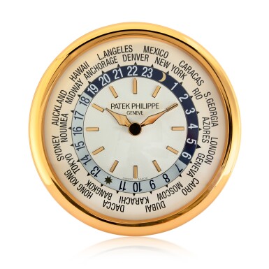 View full screen - View 1 of Lot 202. A large gilt brass wall clock with world time dial, Circa 2000.
