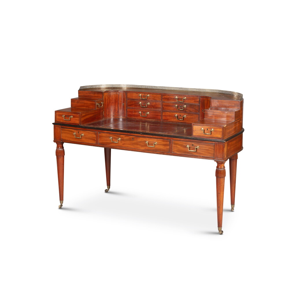 View full screen - View 1 of Lot 135. A late George III gilt-brass and carved mahogany Carlton House desk, early 19th century | Bureau « Carlton House » en acajou et laiton doré de la fin de l'époque George III, début du XIXe siècle.