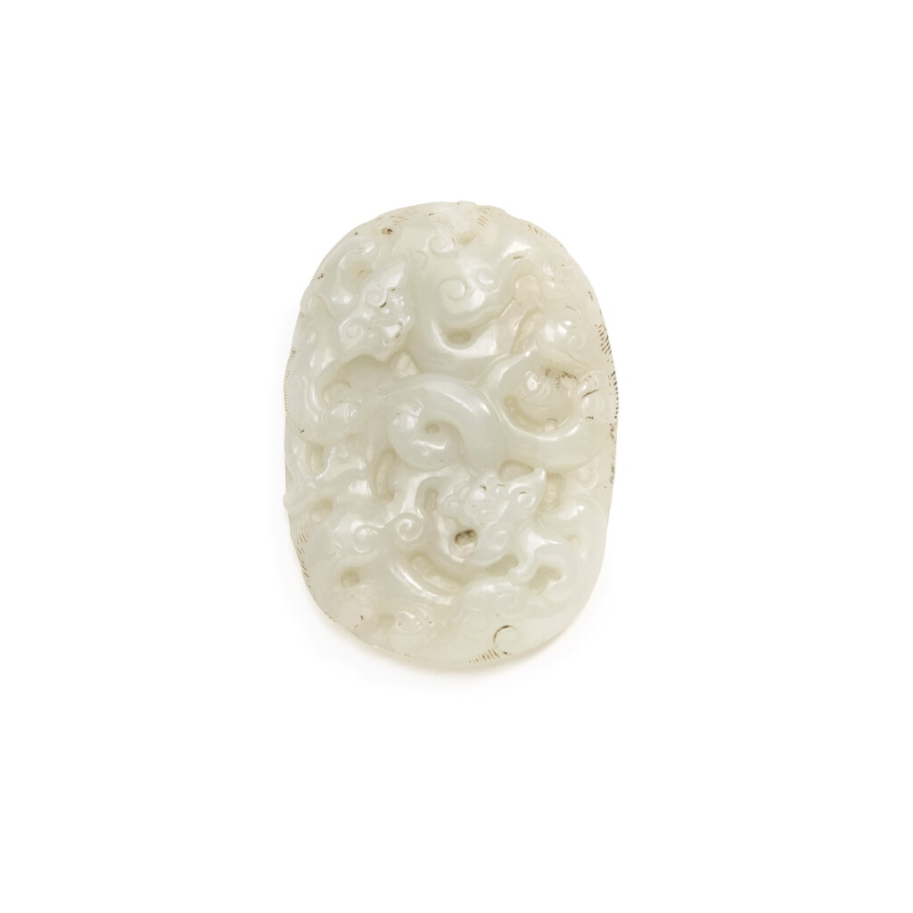 View full screen - View 1 of Lot 243. A CELADON JADE 'CHILONG' PLAQUE, QING DYNASTY, 19TH CENTURY | 清 十九世紀晚期 青白玉螭龍紋牌.