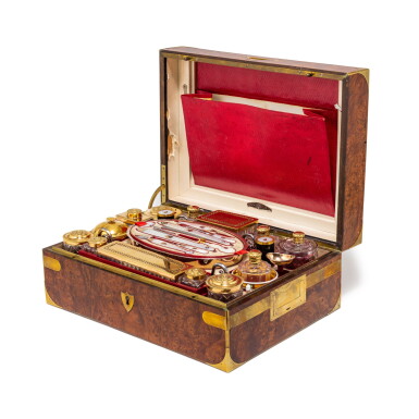 View full screen - View 1 of Lot 422. A silver-gilt, cut glass, silver, porcelain, and steel travel kit in a burr box, P. Taratte, Paris, 1819-1838 | Nécessaire de voyage en vermeil, verre taillé, argent, porcelaine et acier dans un coffret en loupe par P. Taratte, Paris, 1819-1838.