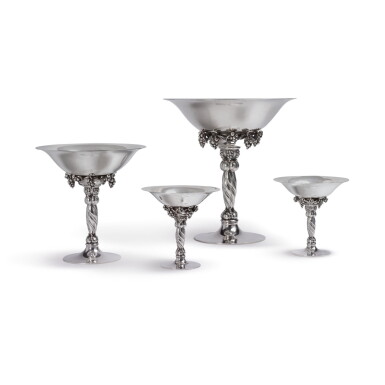 View full screen - View 1 of Lot 946. A GROUP OF FOUR DANISH SILVER GRAPEVINE PATTERN TAZZE, GEORG JENSEN SILVERSMITHY, COPENHAGEN, CIRCA 1945-77.
